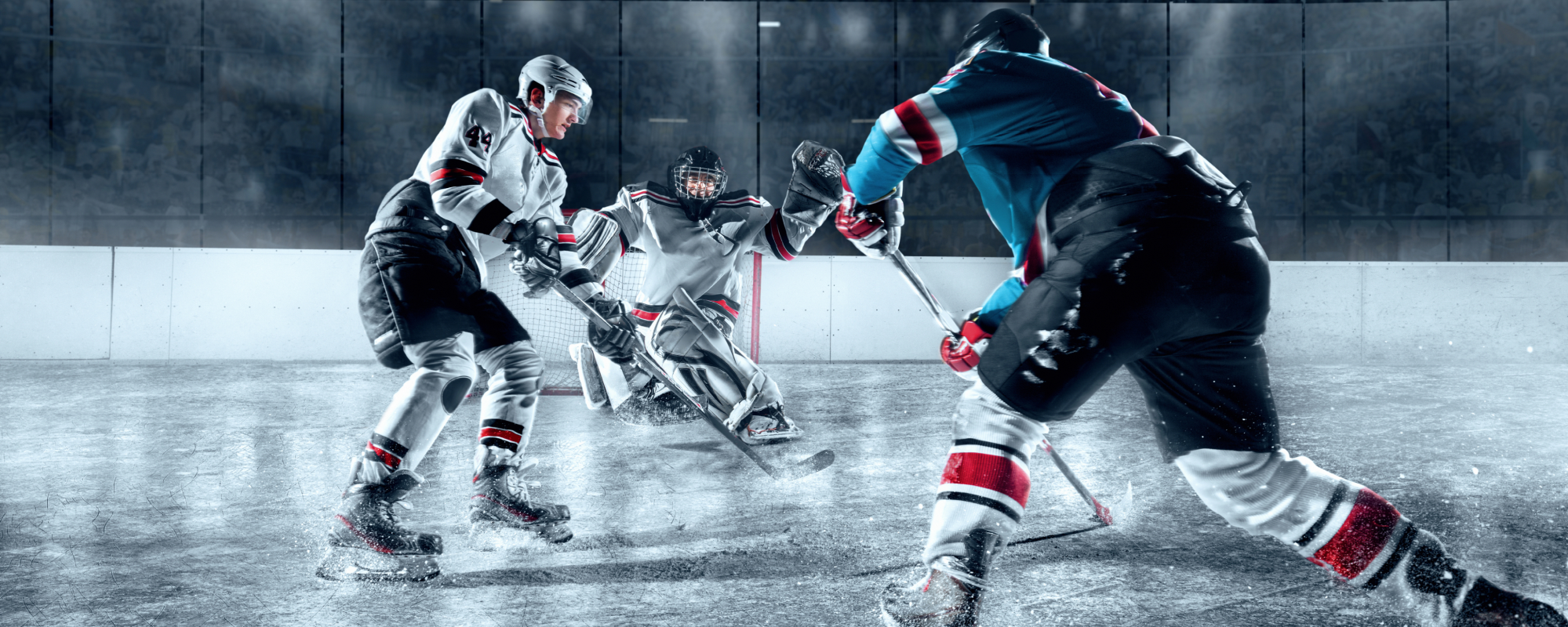 Hockey players passing the puck and scoring
