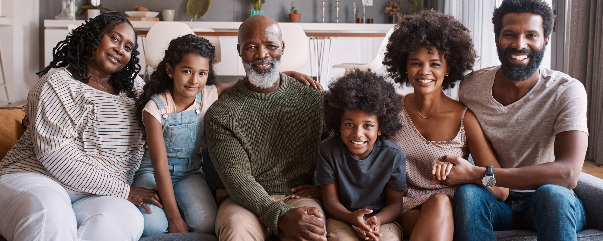 Family of six sitting in a living room