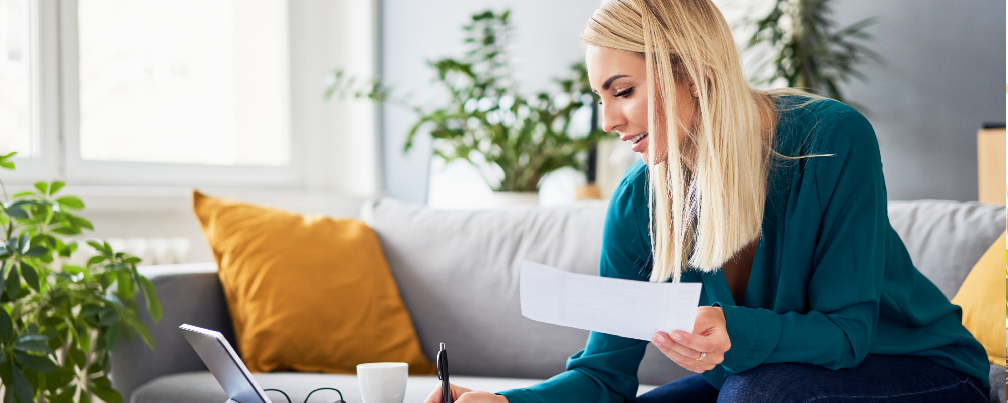 Woman reviewing tax documents in her living room
