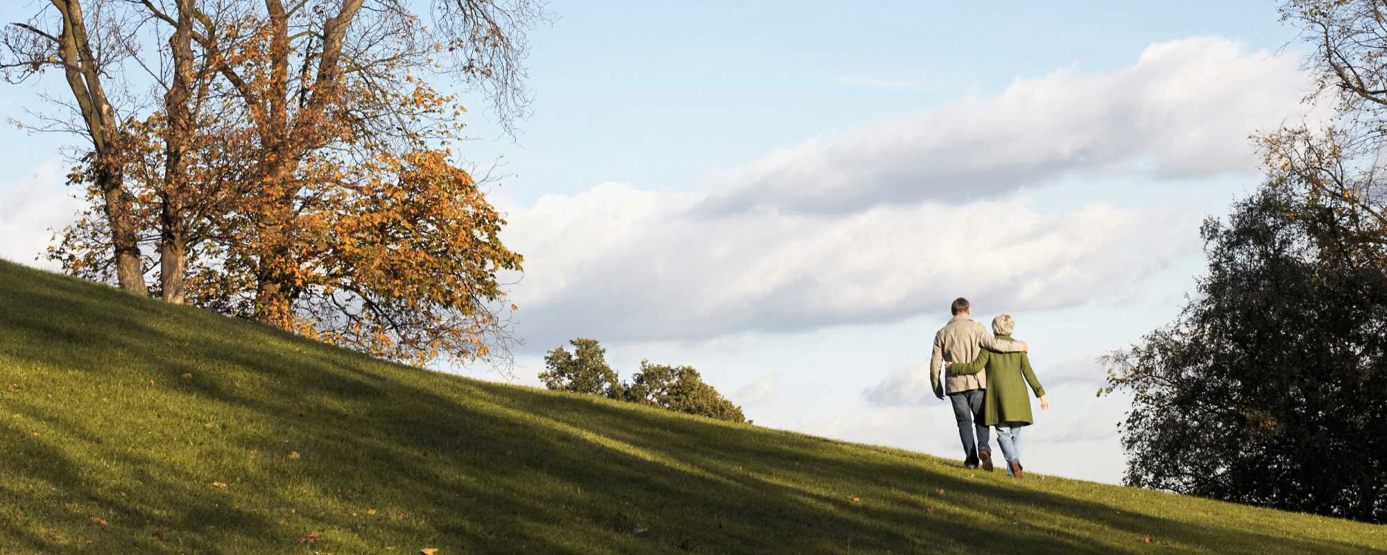 Retired couple walking in a park