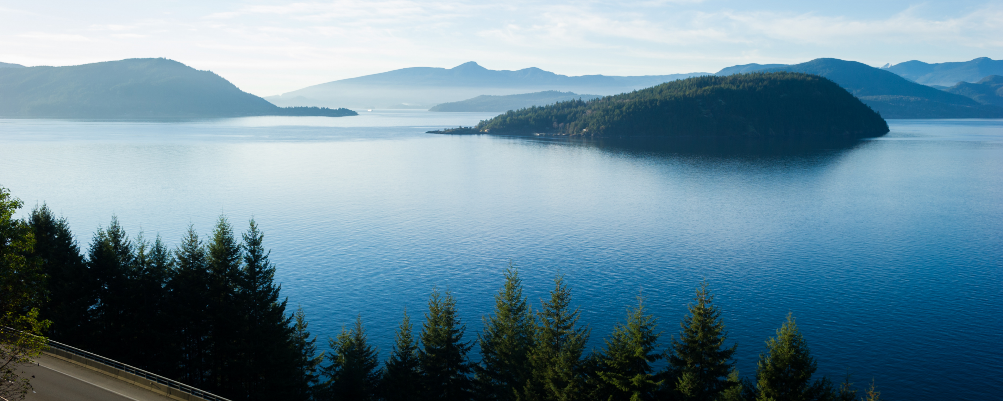 Highway going along a lake in British Columbia