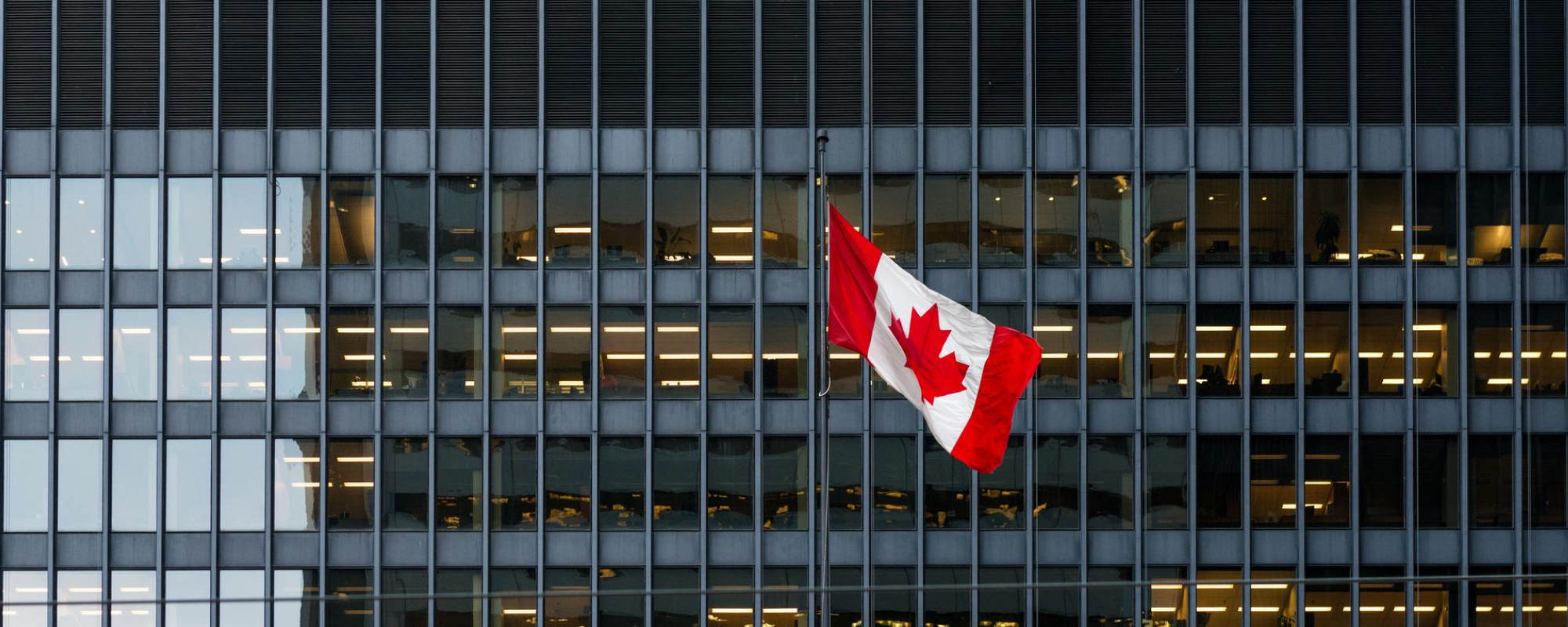 Office building with Canadian flag.