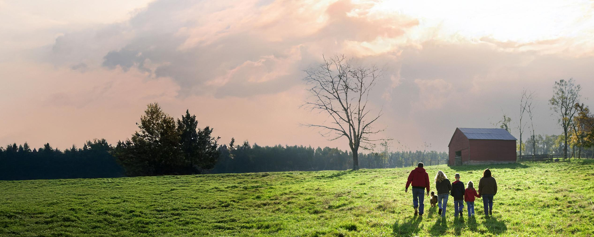 Family walking together on the farm.