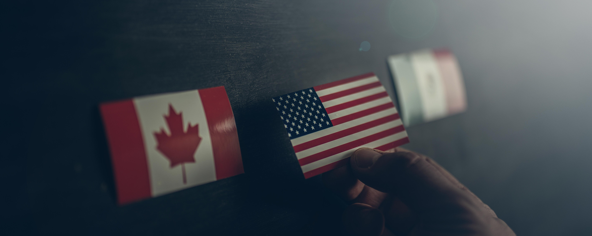 Canadian, American, Mexican flags.