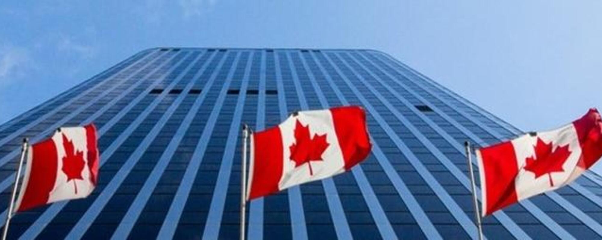 office building with canadian flags.